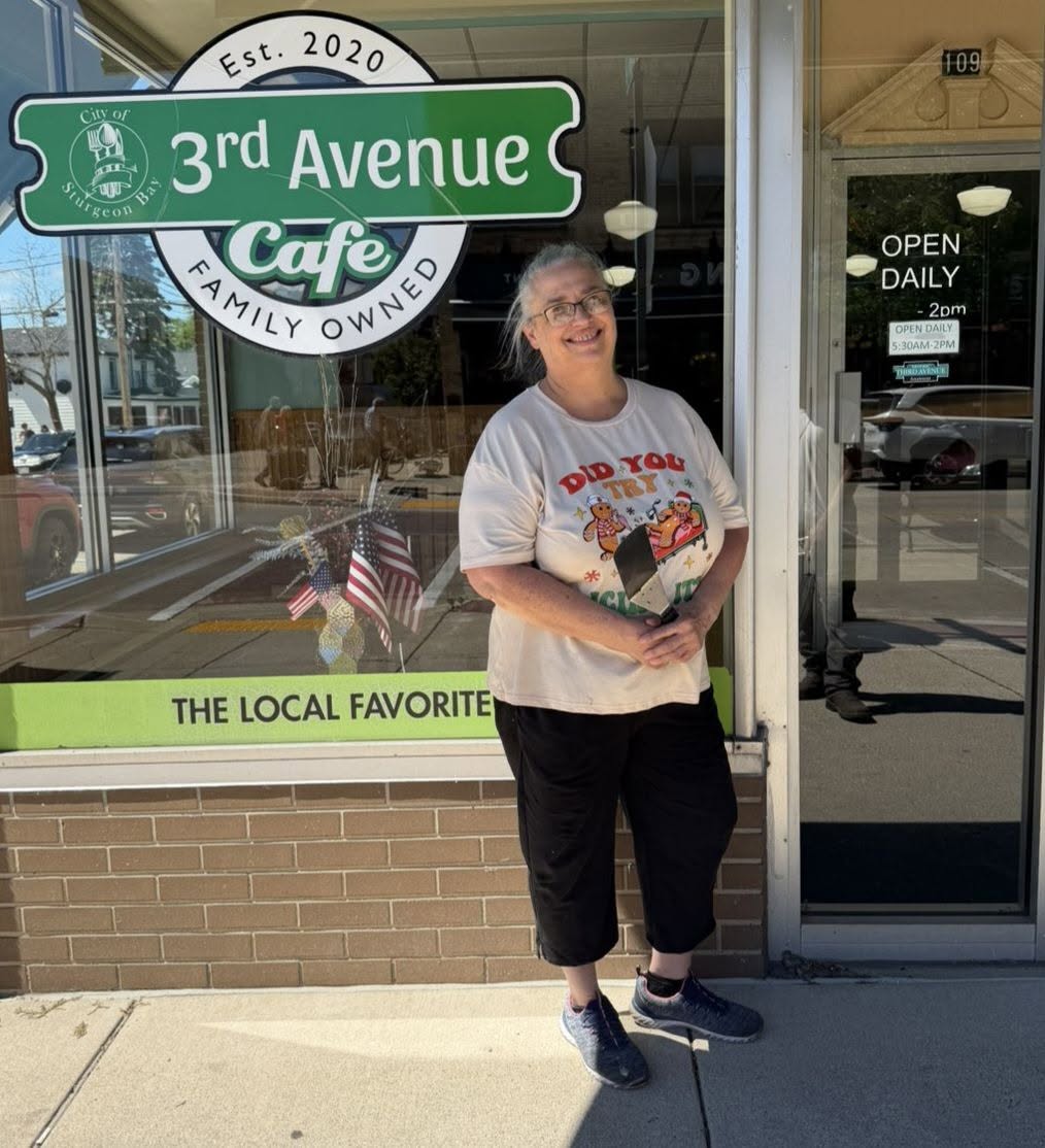 3rd Avenue Cafe team member outside the cafe in downtown Sturgeon Bay